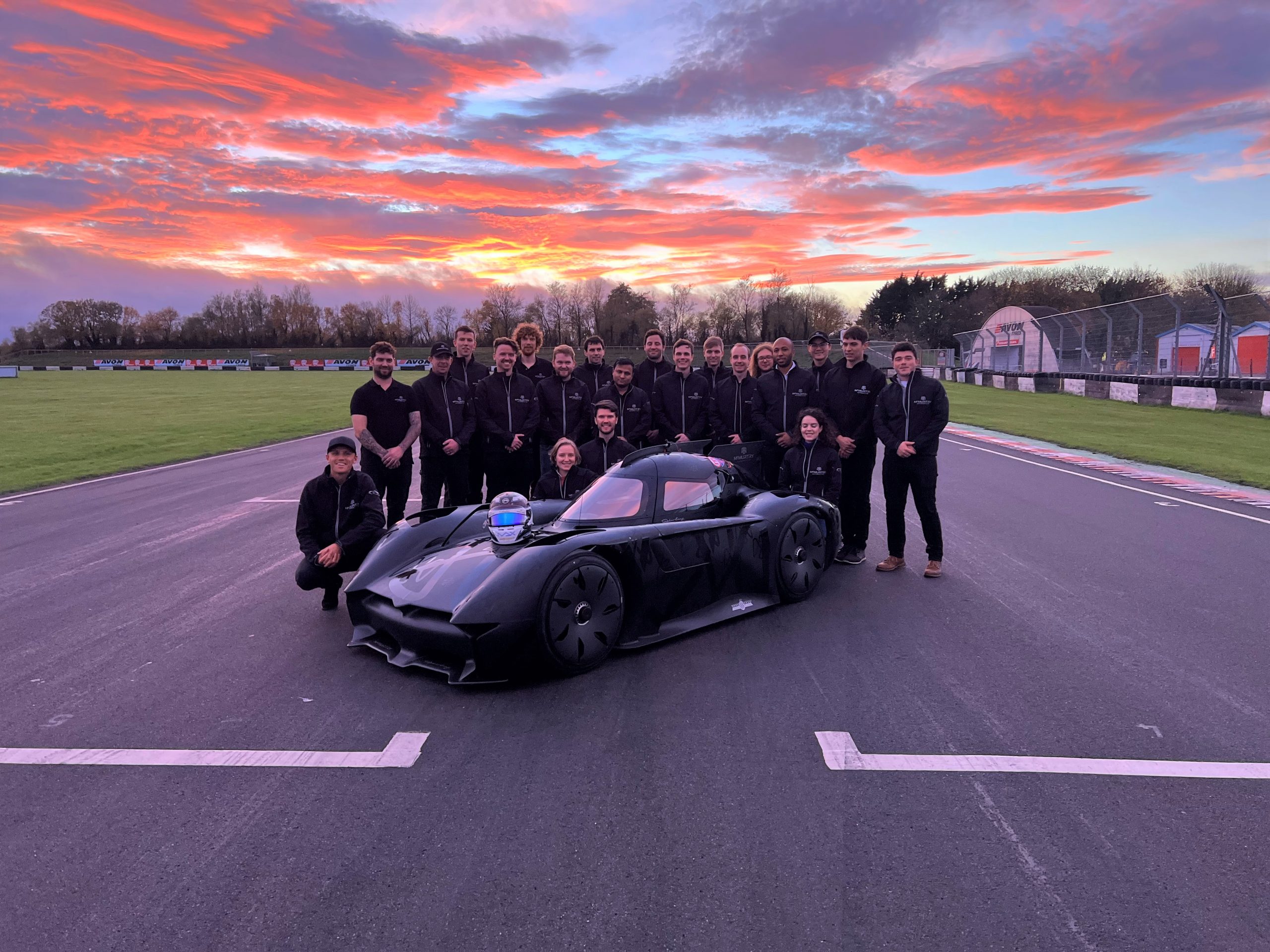 McMurtry Spéirling and Team at Castle Combe Circuit at sunset