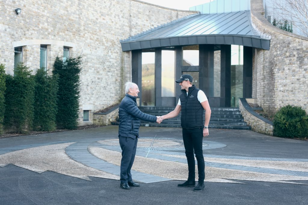 Max Chilton and David McMurtry shake hands outside Swinhay House